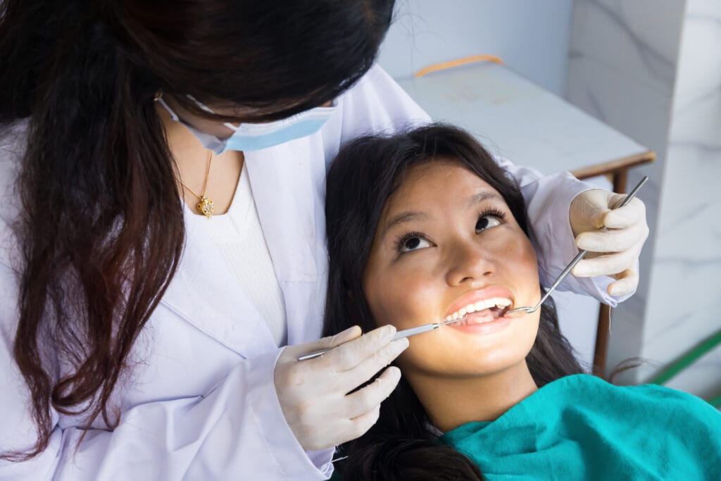 dentist checking up on her patient
