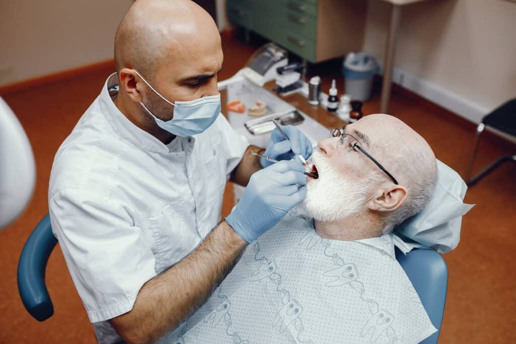 man talking to the dentist
